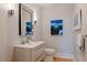 Elegant powder room featuring modern fixtures and stylish decor at 173 1St W St, Tierra Verde, FL 33715