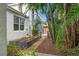 Exterior of home with lush landscaping, a pathway, and raised garden beds at 209 17Th N Ave, St Petersburg, FL 33704