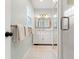 Bathroom featuring a vanity with drawers, and a walk-in shower with white tiled walls at 209 17Th N Ave, St Petersburg, FL 33704