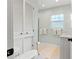Bright bathroom featuring built-in linen storage, and a vanity with white tiled backsplash at 209 17Th N Ave, St Petersburg, FL 33704