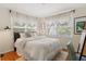Comfortable bedroom with a large bed, natural light, and cozy decor at 209 17Th N Ave, St Petersburg, FL 33704