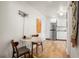 Dining area adjacent to the kitchen, features a modern round table and artistic wall decor at 209 17Th N Ave, St Petersburg, FL 33704