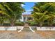 Charming home featuring a landscaped front yard, inviting entryway, and well-manicured trees at 209 17Th N Ave, St Petersburg, FL 33704