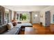 Bright, open-concept living area featuring hardwood floors, comfortable sofa and a neutral color palette at 209 17Th N Ave, St Petersburg, FL 33704