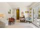 Inviting living space with bar cart, dining table, and French doors to the exterior at 209 17Th N Ave, St Petersburg, FL 33704