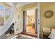 Indoor sunroom featuring hammock and daybed seating with geometric patterned rug at 209 17Th N Ave, St Petersburg, FL 33704
