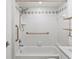 All white bathroom featuring a tub and shower combination and marble top vanity at 209 Ne Lincoln N Cir # 105, St Petersburg, FL 33702