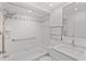 All white bathroom featuring a tub and shower combination and marble top vanity at 209 Ne Lincoln N Cir # 105, St Petersburg, FL 33702
