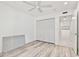 Well-lit bedroom with closet space and modern gray flooring at 209 Ne Lincoln N Cir # 105, St Petersburg, FL 33702