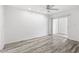 Spacious bedroom with wood-style flooring, offering a modern and comfortable living space at 209 Ne Lincoln N Cir # 105, St Petersburg, FL 33702