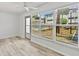 A well-lit sunroom showcases views of the pool and the property's attractive landscaping at 209 Ne Lincoln N Cir # 105, St Petersburg, FL 33702