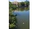 Exterior of waterfront property showcasing calm water views and a well-maintained landscape at 2107 S West Shore Blvd, Tampa, FL 33629