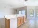 Open kitchen concept with breakfast bar and neutral flooring at 23901 Coral Ridge Ln, Land O Lakes, FL 34639