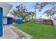 Large, grassy backyard with a fence, ideal for outdoor activities at 2401 E Cayuga St, Tampa, FL 33610