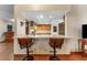 Kitchen area with breakfast bar and views into the kitchen at 2402 Regal Dr, Lutz, FL 33549