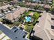 Community aerial view showcasing a pool, landscaping, and organized parking in a well-maintained neighborhood at 2537 Gloriosa Dr # 2, Palm Harbor, FL 34684