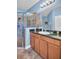Bathroom with glass shower, granite vanity, and tile floor at 2537 Gloriosa Dr # 2, Palm Harbor, FL 34684
