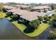 Aerial view of townhomes on a waterfront property showcasing lush landscaping with picturesque waterfront views at 2537 Gloriosa Dr # 2, Palm Harbor, FL 34684