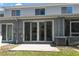 Back patio with sliding glass doors, leading to the home's outdoor area at 2747 Enterprise E Rd # 17, Clearwater, FL 33759