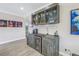 Entertainers bar including custom wood cabinets, wine storage, counter space and custom glassware racks at 289 8Th N Ave, Tierra Verde, FL 33715