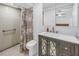 Modern bathroom with a vanity, a shower with a floral curtain, and neutral paint, offering a clean and stylish space at 289 8Th N Ave, Tierra Verde, FL 33715