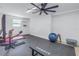 Home gym featuring various exercise equipment, a rubber floor, and a window, perfect for a convenient workout space at 289 8Th N Ave, Tierra Verde, FL 33715