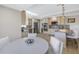 Bright and open kitchen with a breakfast bar and stainless steel appliances, connected to the dining area at 289 8Th N Ave, Tierra Verde, FL 33715