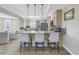 Well-lit kitchen featuring a breakfast bar, modern appliances, and seamless connection to a dining area at 289 8Th N Ave, Tierra Verde, FL 33715