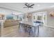 Open living space featuring dining area, oversized couch and multiple windows for lots of light at 289 8Th N Ave, Tierra Verde, FL 33715