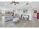 Open-concept living room flowing into a modern kitchen, featuring comfortable seating and stylish accents at 289 8Th N Ave, Tierra Verde, FL 33715