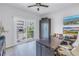 Bright home office with a balcony, a large desk with monitors, and a wardrobe, perfect for working from home at 289 8Th N Ave, Tierra Verde, FL 33715