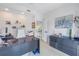 Home office with a large desk, floating shelves, and ample storage, offering a comfortable and functional workspace at 289 8Th N Ave, Tierra Verde, FL 33715