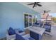Covered patio with plush seating and seamless access through sliding glass doors, perfect for relaxation at 289 8Th N Ave, Tierra Verde, FL 33715