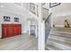 Bright and open staircase with light wood flooring, modern metal railings, and stylish decor at 289 8Th N Ave, Tierra Verde, FL 33715