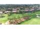 Aerial view of condos overlooking a golf course and pond at 3500 El Conquistador Pkwy # 242, Bradenton, FL 34210