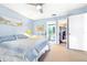 Bedroom with light-blue walls, carpet, and access to a bathroom and closet at 3500 El Conquistador Pkwy # 242, Bradenton, FL 34210