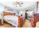 Bright bedroom featuring a bed, dresser, storage, and glass sliding doors at 3500 El Conquistador Pkwy # 242, Bradenton, FL 34210