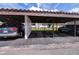 Designated covered parking space for condo residents offering shelter for vehicles at 3500 El Conquistador Pkwy # 242, Bradenton, FL 34210