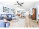Spacious living room area that features hardwood flooring, seating space, and stylish decor at 3500 El Conquistador Pkwy # 242, Bradenton, FL 34210
