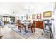 Inviting living room area featuring hardwood floors, dining space, and comfortable furniture at 3500 El Conquistador Pkwy # 242, Bradenton, FL 34210