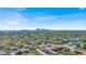 An aerial view of a cityscape far away and a neighborhood nearby full of trees at 3601 N 18Th St, Tampa, FL 33605