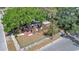 Stripped home features wood frame, no roof, sits on a corner lot near a street at 3601 N 18Th St, Tampa, FL 33605