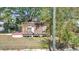 Stripped home features wood frame, no roof, with a small yard at 3601 N 18Th St, Tampa, FL 33605