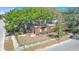 Stripped home features wood frame, no roof, sits on a corner lot with a street sign at 3601 N 18Th St, Tampa, FL 33605