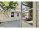 Charming backyard with white wooden siding, deck and a glimpse of the tranquil outdoor setting at 412 E Marshall St, Safety Harbor, FL 34695