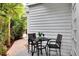 Cozy outdoor patio with seating area offers a private spot to relax and enjoy nature at 412 E Marshall St, Safety Harbor, FL 34695