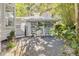 Backyard shed with vines, decorative lattice, and a rock pathway offers a tranquil outdoor setting at 412 E Marshall St, Safety Harbor, FL 34695