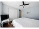 Bedroom featuring wood floors, ceiling fan, and natural light at 4156 Iola Dr, Sarasota, FL 34231