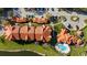 Aerial view of the complex highlighting the well-kept grounds, with an oval pool near the water, for residents at 4209 Woodstorks Walk Way # 1304, Lutz, FL 33558