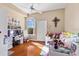 A bedroom featuring a ceiling fan and hardwood floors at 4209 Woodstorks Walk Way # 1304, Lutz, FL 33558